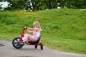 Preview: Mädchen fährt das Winther Viking Challenge Swing Trike auf einem Weg